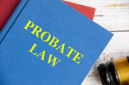 Top view of Probate law book with gavel on white background. Probate law concept